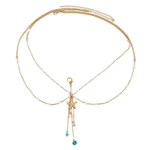 Detailed view of golden multi-layer body chain with starfish pendant and pearls