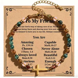 Detailed view of 4mm African turquoise and fossil bead bracelet with gold cross pendant