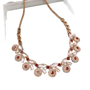 Vintage French palace style necklace with sparkling champagne and red rhinestones.