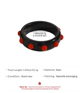 Detailed specifications for this vintage black resin bangle with bold red stud decorations.