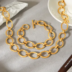 Detailed view of a gold titanium steel necklace with geometric links and OT clasp