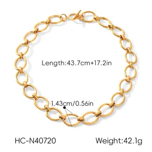 Close-up view of the gold-plated titanium steel necklace showing link size and total length.