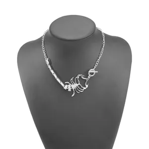Detailed view of silver-colored scorpion necklace with sparkling rhinestone accents