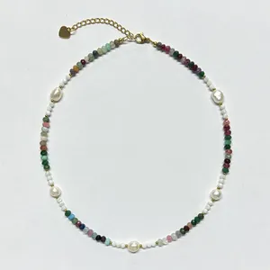 Detailed view of handmade necklace with colorful natural stones and freshwater pearls