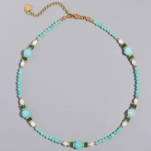 Handmade beaded necklace featuring natural turquoise stones and elegant freshwater pearls