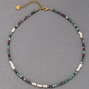 Close-up of colorful natural stone beads and freshwater pearls on a delicate necklace