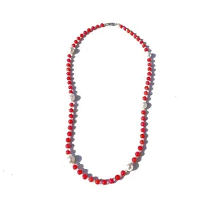 Elegant handmade beaded necklace featuring vibrant red stones and freshwater pearls.