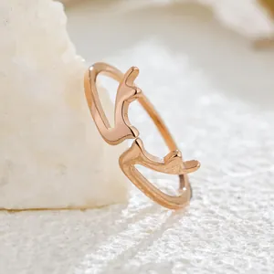 Close-up of minimalist rose gold deer antler open ring showing fine texture