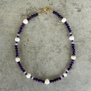 Elegant handmade purple beaded choker necklace featuring genuine freshwater pearls and gold clasp
