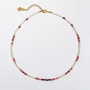 Handmade necklace with colorful natural stones and freshwater pearls with heart charm.