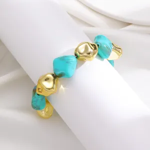 Close-up of chunky irregular turquoise and gold CCB beaded bracelet texture