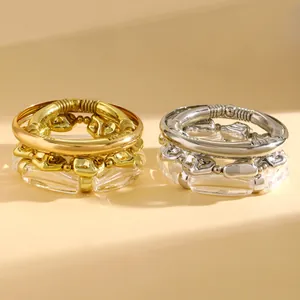 Close-up of vintage chunky resin and metallic bead bracelet set in gold and silver