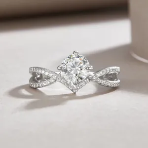 Elegant sterling silver ring with a round lab diamond and criss-cross pave band.
