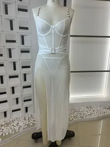 Detailed view of white sheer mesh lingerie with pearl straps and high slit design