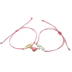 Magnetic heartbeat charm couple bracelets with pink braided string and heart connect