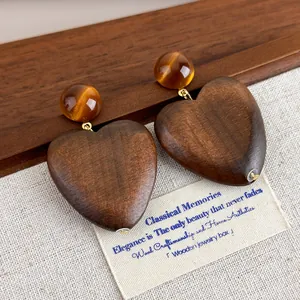 Vintage wooden heart drop earrings with amber beads and natural wood grain texture