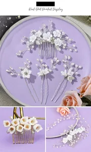 Detailed view of handmade white flower bridal hair comb set with pearls and crystals