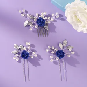Elegant bridal hair comb and pin set with royal blue roses and pearls on purple background.