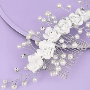 Elegant bridal hair comb with white roses, pearls and crystals on lavender background