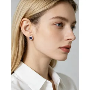 Elegant square blue zircon S925 sterling silver stud earrings worn by a female model