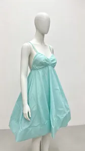 Side view of light blue puff hem babydoll dress with spaghetti straps and deep V-neck