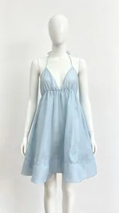 Elegant light blue halter neck mini dress featuring deep V-neck and pleated skirt detail