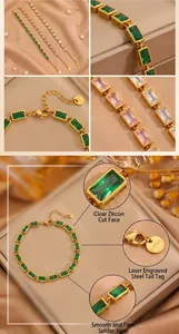 Macro details of elegant gold stainless steel bracelet with faceted green zircons