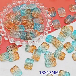 High-quality detailed view of 18x13mm blue and amber gradient glass flower beads