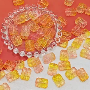 Close-up of 18x13mm amber glass beads with textured surface for DIY jewelry making.