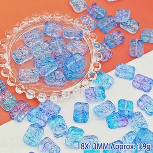 Detail view of 18x13mm blue and purple floral glass beads for jewelry making