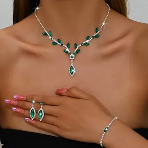 Exquisite close-up of emerald green marquise crystal jewelry set worn by a model 2024