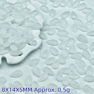 Detailed view of 8x14mm opalescent white teardrop glass beads for DIY jewelry making