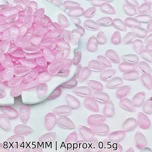 Detailed macro view of 8x14mm translucent pink teardrop glass beads for DIY jewelry crafts
