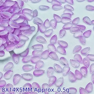 Detailed macro view of 8x14mm purple teardrop glass beads for DIY jewelry making