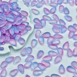 Detailed view of 8x14mm pink and blue gradient teardrop glass beads for DIY jewelry