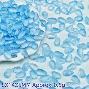 Macro view of 8x14x5mm light blue teardrop glass beads for DIY jewelry making crafts.