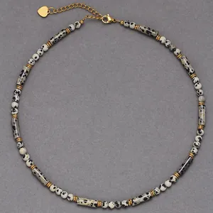 Detailed view of a handmade dalmatian jasper stone necklace with gold-tone accents