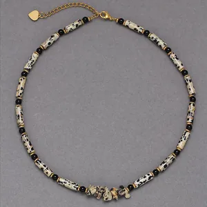 Close-up detail of Minimalist Dalmatian Jasper beaded necklace with leopard pattern
