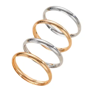 Stylish set of four polished minimalist silver and gold metallic bangles for women