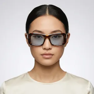 Fashionable square tortoise shell sunglasses with blue tinted lenses worn by model
