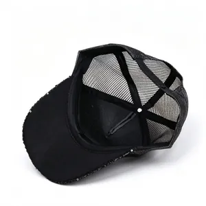 Detailed interior view of black mesh baseball cap with sparkly sequin accents