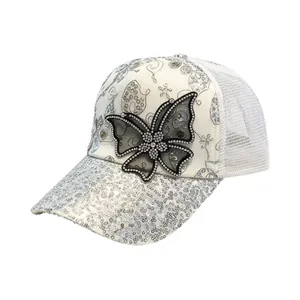 Elegant white mesh baseball cap featuring a large rhinestone butterfly and silver sequined brim