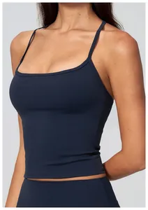 Close-up of a navy blue yoga camisole with thin straps and smooth naked-feel fabric