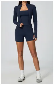 Full view of navy blue yoga set including jacket, sports bra, and shorts