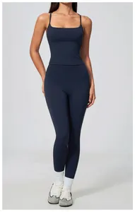 Seamless navy blue yoga tank top and high waist leggings set on model for fitness workout