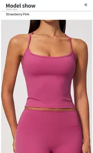 Detail of a strawberry pink naked-feel yoga tank top with thin racerback straps
