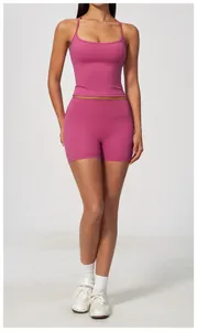Detailed view of magenta slim-fit yoga camisole and matching biker shorts set