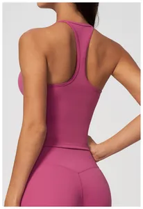 Macro view showing the racerback detail of a pinkish-purple tight yoga vest for women