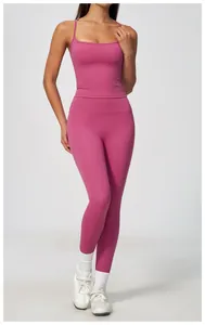 Detail view of pink high-stretch yoga set fit on a model in a professional studio