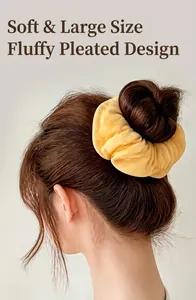 Close-up of a soft yellow oversized pleated scrunchie styled on a model's hair bun.